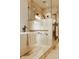 Bright bathroom featuring a soaking tub, glass shower, and neutral toned tiling and decor at 9387 Sullivan Pl, Zionsville, IN 46077
