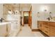 Luxurious bathroom showcases a walk-in shower, a modern vanity, a soaking tub and access to the walk-in closet at 9387 Sullivan Pl, Zionsville, IN 46077