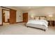 Spacious bedroom with a sliding barn door to an ensuite bathroom and a large closet at 9387 Sullivan Pl, Zionsville, IN 46077