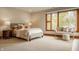 Bedroom featuring a cozy bed, natural light, and sitting area at 9387 Sullivan Pl, Zionsville, IN 46077