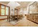Elegant dining room with large windows, stylish decor, and ample seating at 9387 Sullivan Pl, Zionsville, IN 46077