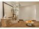 Dining room with textured wood table, decorative cabinet, and stylish accents at 9387 Sullivan Pl, Zionsville, IN 46077