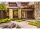 Charming entrance with brick facade, stone columns, and lush greenery at 9387 Sullivan Pl, Zionsville, IN 46077