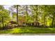 Beautifully landscaped front yard of a home with a mix of brick and stone architecture at 9387 Sullivan Pl, Zionsville, IN 46077