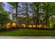 Stunning stone home with lush landscaping and mature trees providing privacy and curb appeal at 9387 Sullivan Pl, Zionsville, IN 46077