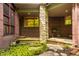 Charming backyard patio with a stone pathway, lush greenery, and outdoor seating area at 9387 Sullivan Pl, Zionsville, IN 46077