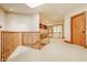 Hallway boasts natural light, a skylight and an entrance to the outside patio at 9387 Sullivan Pl, Zionsville, IN 46077