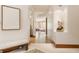 Elegant hallway with hardwood floors, recessed lighting, and stylish decor leading to the living area at 9387 Sullivan Pl, Zionsville, IN 46077