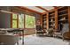 Beautiful office with custom wood built-ins, trim and large window at 9387 Sullivan Pl, Zionsville, IN 46077
