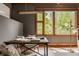 Bright home office featuring large window, wood trim and modern light fixture at 9387 Sullivan Pl, Zionsville, IN 46077