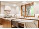 Well-equipped kitchen with a large island, modern appliances, and a stylish backsplash at 9387 Sullivan Pl, Zionsville, IN 46077