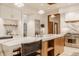 Bright kitchen featuring modern cabinets, stainless steel appliances, and large island with seating at 9387 Sullivan Pl, Zionsville, IN 46077