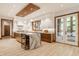 Modern kitchen with custom cabinetry, waterfall island, and stainless steel appliances at 9387 Sullivan Pl, Zionsville, IN 46077