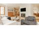 Spacious living room with modern fireplace, comfortable furniture, and natural light at 9387 Sullivan Pl, Zionsville, IN 46077