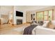 Bright living room features a fireplace, large windows, and stylish furnishings at 9387 Sullivan Pl, Zionsville, IN 46077