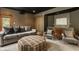 Comfortable living room includes gray sofa and chairs, and an ottoman at 9387 Sullivan Pl, Zionsville, IN 46077