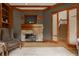 Cozy living room features stone fireplace and leads to the staircase at 9387 Sullivan Pl, Zionsville, IN 46077