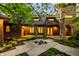 Inviting patio area with stone accents and well-manicured landscaping, perfect for outdoor entertaining at 9387 Sullivan Pl, Zionsville, IN 46077