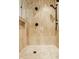 Luxurious shower featuring marble-style tile and black hardware at 9387 Sullivan Pl, Zionsville, IN 46077