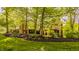 Exterior view of a stone walkway and retaining wall leading to a home with mixed stone and brick accents at 9387 Sullivan Pl, Zionsville, IN 46077
