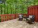 Cozy deck with comfortable wicker chairs, perfect for enjoying the tranquil wooded views and peaceful surroundings at 9493 Timber View Dr, Indianapolis, IN 46250