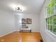 Bedroom featuring hardwood floors, natural light, and modern light fixture at 9493 Timber View Dr, Indianapolis, IN 46250