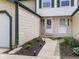 Charming front entrance with well manicured landscaping and solar powered accent lighting at 9493 Timber View Dr, Indianapolis, IN 46250