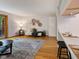 Bright living room shows hardwood floors, sliding glass door to deck and updated kitchen at 9493 Timber View Dr, Indianapolis, IN 46250
