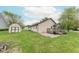 Spacious backyard featuring a wooden deck, storage shed and lots of space at 980 Red Maple Ct, Greenwood, IN 46143