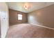 Bedroom with a standard ceiling fan, neutral walls, plush carpet and a small window at 980 Red Maple Ct, Greenwood, IN 46143