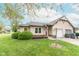 Charming single-story home featuring a manicured lawn and attached garage, perfect for suburban living at 980 Red Maple Ct, Greenwood, IN 46143