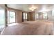 Bright living room featuring neutral paint, plush carpet, and ample natural light from multiple windows at 980 Red Maple Ct, Greenwood, IN 46143