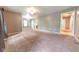 Expansive living room featuring neutral walls, plush carpet, and versatile layout for entertaining at 980 Red Maple Ct, Greenwood, IN 46143