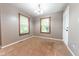 Neutral room with hardwood trim windows and an interior door at 980 Red Maple Ct, Greenwood, IN 46143