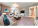 Spacious living room with neutral paint, plush carpet, and comfortable seating arrangement at 980 Red Maple Ct, Greenwood, IN 46143