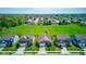 An aerial view displays the home's position within the neighborhood, framed by mature trees and green spaces at 9823 Pica Dr, Fishers, IN 46040