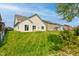 Large, well-maintained backyard with a pristine lawn and a view of neighboring houses at 9823 Pica Dr, Fishers, IN 46040