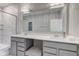 Modern bathroom featuring double sink vanity with gray cabinets and a separate shower at 9823 Pica Dr, Fishers, IN 46040