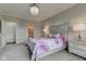 Primary bedroom showcasing a decorative chandelier and ensuite access at 9823 Pica Dr, Fishers, IN 46040