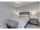 Tastefully furnished bedroom with soft neutral decor, a large bed, and side tables with lamps at 9823 Pica Dr, Fishers, IN 46040