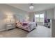 Spacious primary bedroom featuring a large window and decorative chandelier at 9823 Pica Dr, Fishers, IN 46040