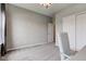 Neutrally decorated bedroom featuring a stylish chair and a closet with sliding doors at 9823 Pica Dr, Fishers, IN 46040