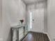 Stylish entryway with a decorative mirror console table and elegant front door at 9823 Pica Dr, Fishers, IN 46040