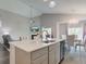 Open concept kitchen with an island, stainless steel appliances, and a seamless flow to the dining area at 9823 Pica Dr, Fishers, IN 46040