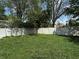 Large fenced backyard with a neatly mowed green lawn and bright sunlight at 9976 W Center St, Anderson, IN 46011