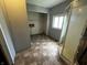 Bathroom and laundry area with patterned flooring and a standing shower at 9976 W Center St, Anderson, IN 46011