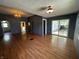 Spacious living room with hardwood floors, gray walls, and a sliding glass door at 9976 W Center St, Anderson, IN 46011