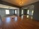Spacious living room with hardwood floors, neutral walls, and multiple windows for natural light at 9976 W Center St, Anderson, IN 46011