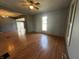 Bright living room with hardwood floors, a ceiling fan, and lots of natural light at 9976 W Center St, Anderson, IN 46011