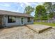 Exterior backyard view with wooden deck and patio along the back of the house at 101 N Westbury Rd, Pendleton, IN 46064